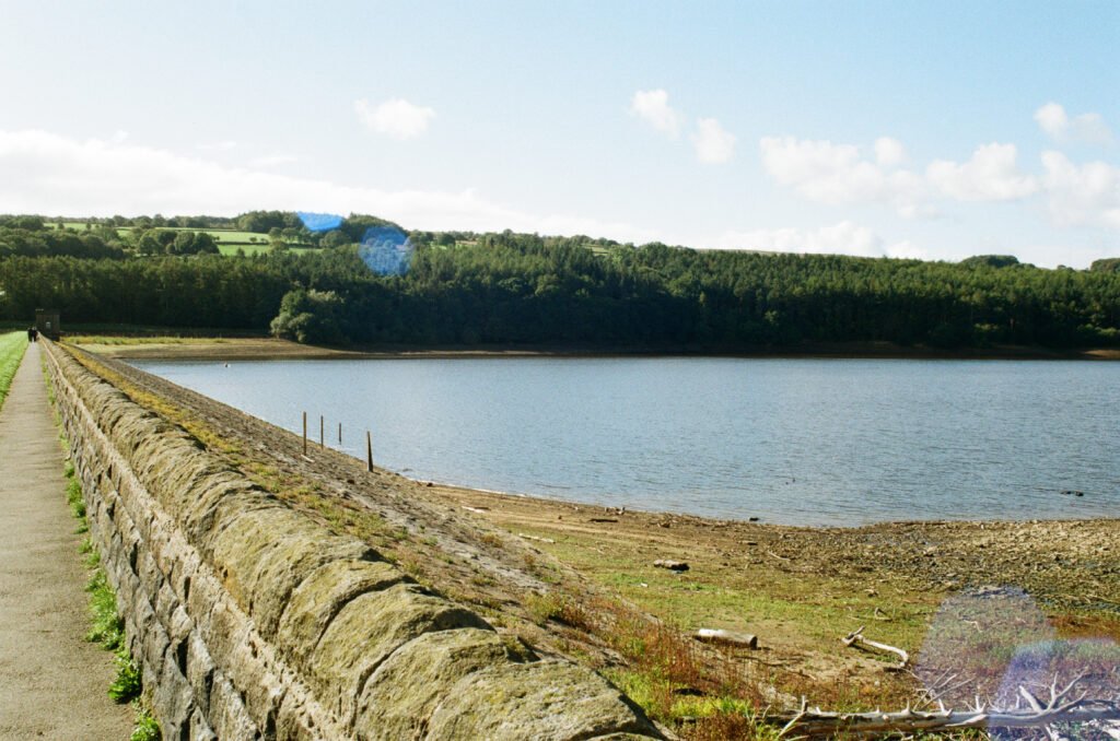 Dam wall with the water to the right.